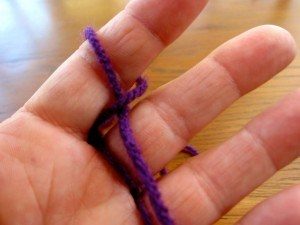 hand holding a piece of thread
